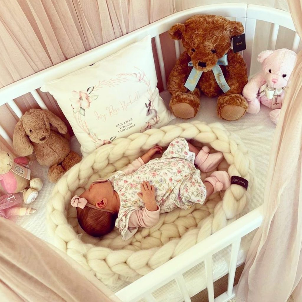 white baby knitted nest